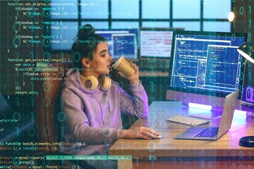 Poster - Young female programmer drinking coffee while working in office