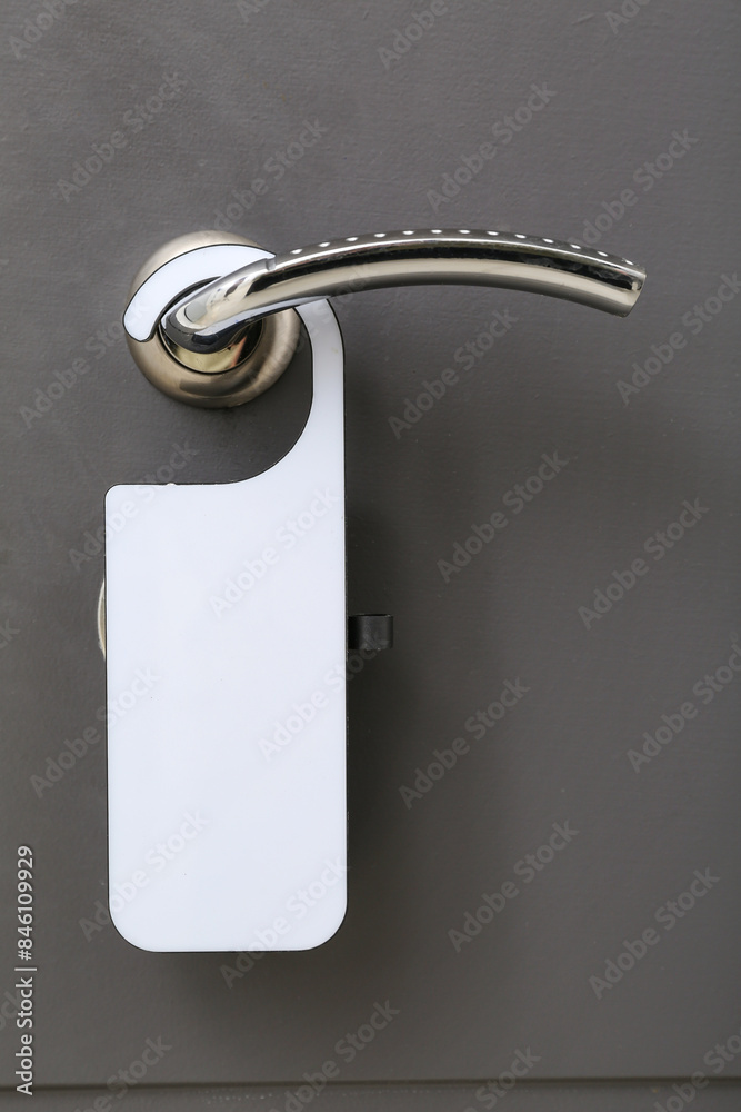 Black modern door in hotel room with door hanger