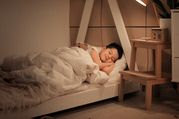 Sticker - Cute little Asian boy sleeping in bed