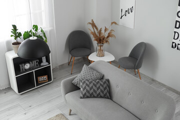 Sticker - Interior of modern living room with comfortable sofa and stylish furniture