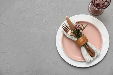 Wall Mural - Table setting with beautiful flowers on grey background