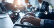 © jex - A businessman using a laptop, with social network connections and people icons displayed on the screen. The concept of digital marketing for business, human resources, and global customer network.