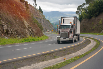 Wall Mural - Truck with refrigeration on a curve on a Colombian highway in a rural area