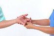 © Photo Sesaon - Doctor checks the hand of a woman who has palm pain and finger pain. Finger stimulated from work and airplane, office syndrome medical concept