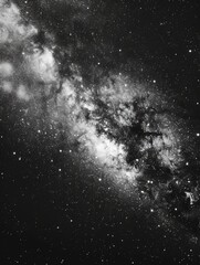 Wall Mural - A black and white photo of a galaxy with a large white star in the middle