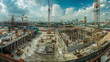 © Kavidu - Panorama view of workers on large construction sites with many cranes at work, illustrating the industry of new building business.