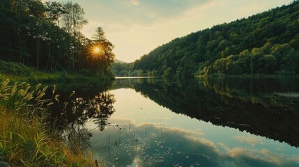 Wall Mural - a beautiful lake with a sun reflecting on the water