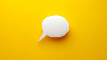 Talk bubble speech icon in hand over yellow background, panoramic layout ,White paper in speech bubble shape set against yellow background