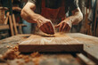 © Emanuel - Male carpenter working diligently in a well-equipped workshop, highlighting craftsmanship and woodworking skills