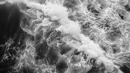 Wall Mural - the image is a black and white photo of ocean waves crashing against the shore