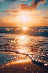 Wall Mural - the sun is setting over the ocean, casting a warm glow on the water
