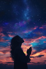 Wall Mural - a woman is praying in front of a beautiful night sky