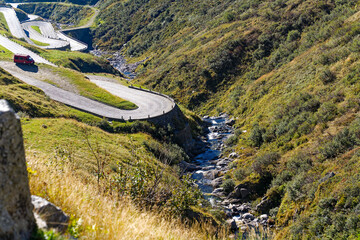 Scenic view of mountain pass road named Tremola at Swiss mountain pass Gotthard on a sunny late summer day. Photo taken September 10th, 2023, Gotthard, Canton Ticino, Switzerland.