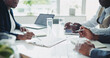 © peopleimages.com - Business, people and contract discussion in boardroom, partnership and b2b terms with clients or company growth. Collaboration, negotiation and heal in office with paperwork, consultation and meeting