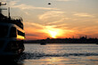 © Igor - Silhouette of Sultanahmet district and its mosques during a colorful sunset. A boat is sailing on the Bosphorus.