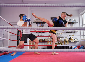 Wall Mural - Kickboxers sparring in the ring