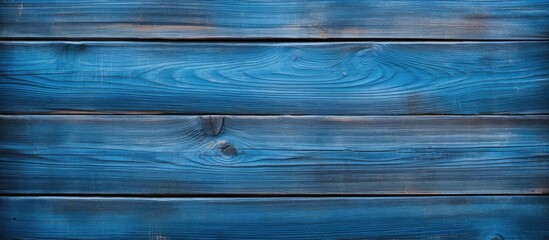 Wall Mural - A blue panel with a wood texture creates a captivating background in this copy space image