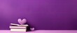 © StockKing - A minimal style copy space image showcasing a purple background with a small white heart containing patches surrounded by upright books A top view that represents the concepts of reading self help an