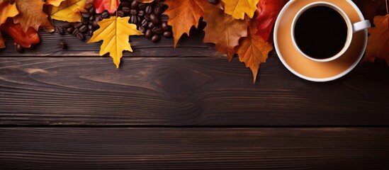 Wall Mural - A heart shaped frame surrounds a composition of autumn leaves on a table accompanied by a coffee cup Ample space is available for additional images or text