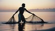 © abu - silhouette of  A traditional fisherman casting a net into the ocean at dawn