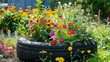 © Paul - Upcycled tire garden with vivid flowers, a colorful and eco-conscious gardening design, sustainable beauty