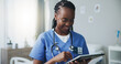 © peopleimages.com - Happy, tablet and doctor in hospital, healthcare and email with online reading, internet and connection. Black woman, nurse and employee in medicare clinic, tech or network with digital app and smile