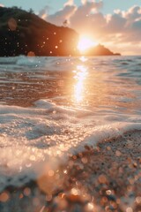 Wall Mural - the sun is setting over the ocean, casting a warm glow on the water