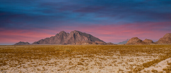 Wall Mural - Sunset of the mountains in Spotzkoppe in Namibai