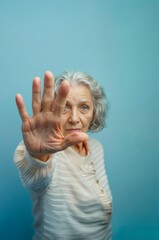 AI generated illustration of a woman standing against a blue background, world elder abuse awareness