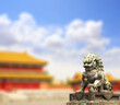 © frenta - Horizontal background with ancient pavilions and lion statue in Forbidden City. Bronze chinese guardian lion, Beijing, China
