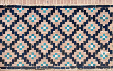 Wall Mural - Vertical or horizontal background with detail of ancient mosaic walls with clay details and geometric ceramic tile ornament. Traditional iranian tile decorations