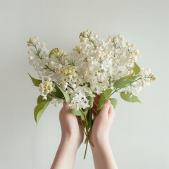 Poster - AI-generated illustration of a Woman's hands holding white flowers against white wall