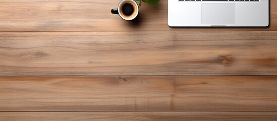 Aufkleber - The office table is seen from above displaying a laptop a notepad and a cup of coffee There is enough free space for additional images or text