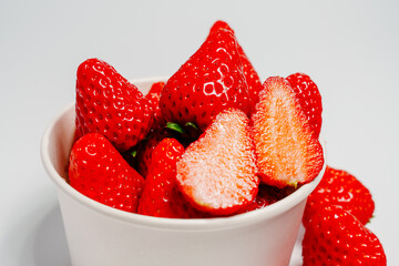 Closeup photo of red strawberry against white background