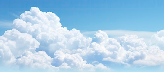 Wall Mural - Copy space image with the word LARGE set against a backdrop of a sky painted with fluffy white clouds