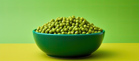 Aufkleber - There is a bowl with vibrant green peas placed against a colorful background in this image. copy space available
