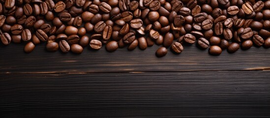 Poster - Copy space image featuring roasted coffee beans placed on a dark wooden background