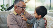 © Azeemud/peopleimages.com - Grandfather, child and relax on sofa at house for bonding, love and memory for care on weekend break. Smile, mature man and boy with excited gratitude, support and trust together in childhood home