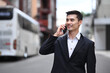 © Prathankarnpap - Businessman executive in formal clothes having phone conversation walking on city street talk