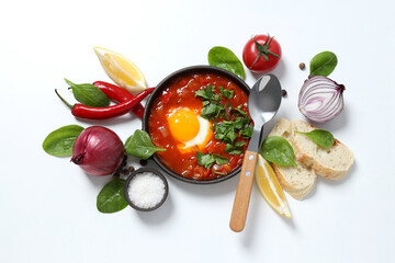Wall Mural - Shakshuka with fresh vegetables on a white background
