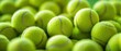 © Purichaya - Lively background filled with a multitude of tennis balls, showcasing their texture
