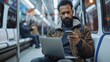 © Iuliia Metkalova - Multiracial african man uses his laptop and smartphone on city train. Generative ai