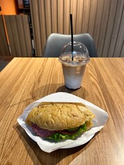 Wall Mural - Iced coffee and a salami sandwich