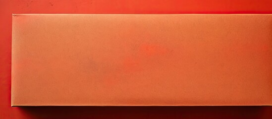 Poster - Vibrant red abstract paper texture background with an old Kraft paper box showcasing an orange craft pattern, viewed from the top, against an active color backdrop with copy space image.