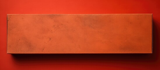 Poster - Vibrant red abstract paper texture background with an old Kraft paper box showcasing an orange craft pattern, viewed from the top, against an active color backdrop with copy space image.