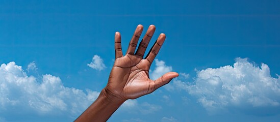 Poster - Sri Lanka's blue sky provides a vivid background for these hands with a copy space image.