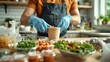 © ifoto - A delivery man is preparing to put food in paper cups and plastic containers on the table