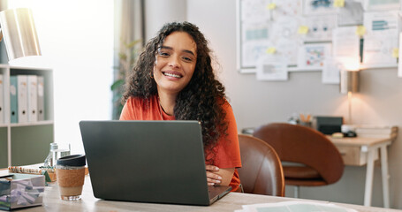 Poster - Portrait, woman and smile at desk with laptop, communication and update in office. Female journalist, confident and happy at computer for article, social media and contact in modern workplace in city