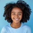 © gen_pick - Joyful African American Girl in Blue Shirt