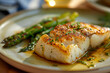 © Damian - plate of baked cod with a side of roasted asparagus